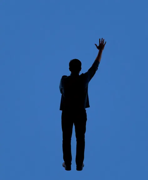 a guy waving goodbye