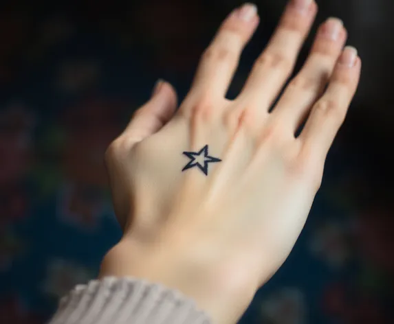 star tattoo on hand