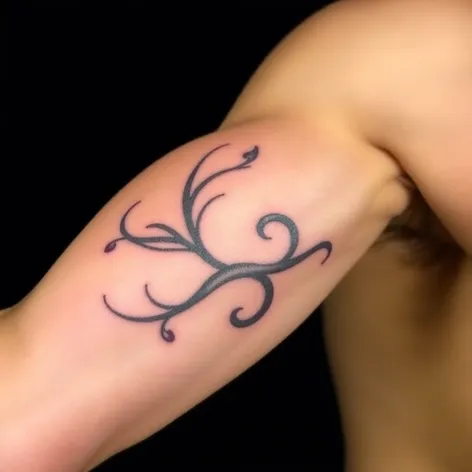 inner bicep tattoo