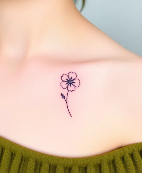 fine line flower tattoo